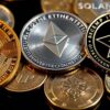 Photograph of Bitcoin, Ethereum, and Solana coins together.